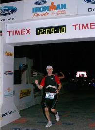 Matt Walsh crossing the finish line at Ironman Florida